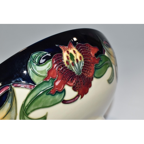 364 - A BOXED MOORCROFT POTTERY 'ANNA LILY' DESIGN BOWL, designed by Nicola Slaney, diameter 26cm (1) (Con... 