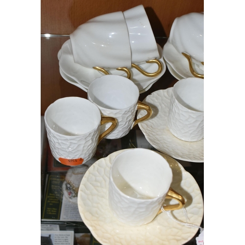 384 - A GROUP OF AYNSLEY AND COALPORT TEAWARE, comprising six white textured Coalport coffee cans with gil... 