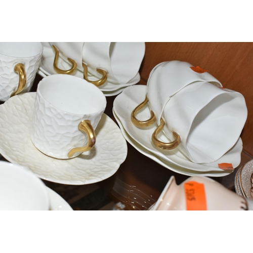 384 - A GROUP OF AYNSLEY AND COALPORT TEAWARE, comprising six white textured Coalport coffee cans with gil... 