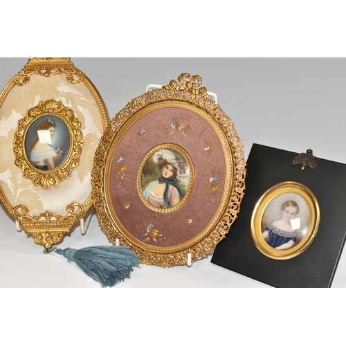 385 - FOUR MODERN PORTRAIT MINIATURES, painted in a 19th century style, three depict women and one depicts... 