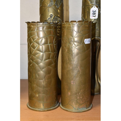 387 - TWO PAIRS OF TRENCH ART VASES, comprising two engraved with bunches of holly and the dates 1914 and ... 