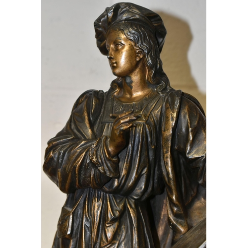 388 - A BRONZED SPELTER SCULPTURE OF AN ARTIST, standing with paintbrush and artwork, resting on a classic... 