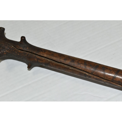 471 - AN 18TH CENTURY GNARLED WOOD, INLAID PIN WORK AND PAINTED WALKING CANE, the smoothed top bearing inl... 