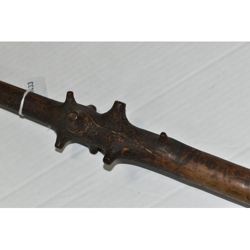 471 - AN 18TH CENTURY GNARLED WOOD, INLAID PIN WORK AND PAINTED WALKING CANE, the smoothed top bearing inl... 