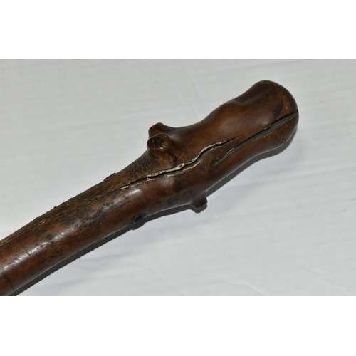 471 - AN 18TH CENTURY GNARLED WOOD, INLAID PIN WORK AND PAINTED WALKING CANE, the smoothed top bearing inl... 