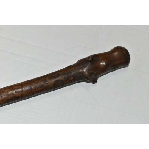 471 - AN 18TH CENTURY GNARLED WOOD, INLAID PIN WORK AND PAINTED WALKING CANE, the smoothed top bearing inl... 