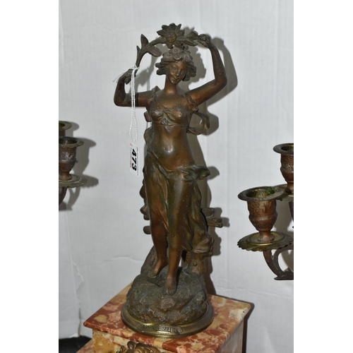 473 - A FRENCH ROSE MARBLE CLOCK GARNITURE, clock supporting a bronzed figure of a woman 'Rayon De Soleil'... 