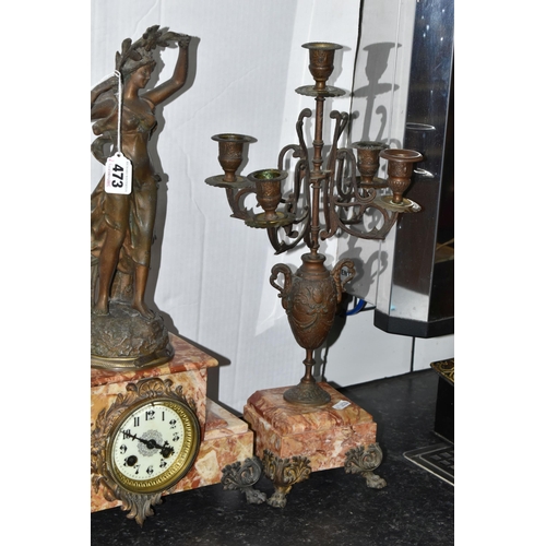 473 - A FRENCH ROSE MARBLE CLOCK GARNITURE, clock supporting a bronzed figure of a woman 'Rayon De Soleil'... 