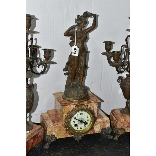 473 - A FRENCH ROSE MARBLE CLOCK GARNITURE, clock supporting a bronzed figure of a woman 'Rayon De Soleil'... 