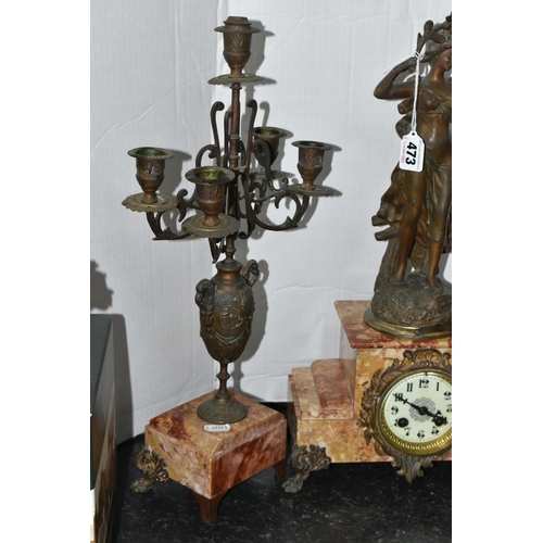 473 - A FRENCH ROSE MARBLE CLOCK GARNITURE, clock supporting a bronzed figure of a woman 'Rayon De Soleil'... 