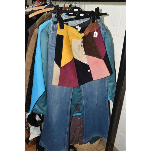 485 - A GROUP OF VINTAGE CLOTHING, to include a 'Chelsea Girl' multicoloured patchwork mini skirt, a pair ... 