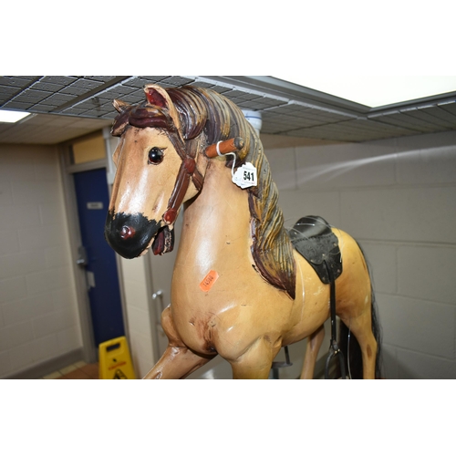 541 - WOOD ANTIQUE STYLE ROCKING HORSE, height approximately 65cm, embossed leather look saddle, metal sti... 