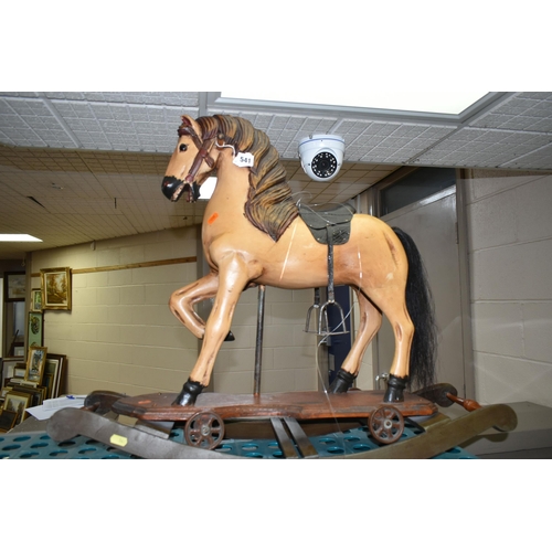 541 - WOOD ANTIQUE STYLE ROCKING HORSE, height approximately 65cm, embossed leather look saddle, metal sti... 