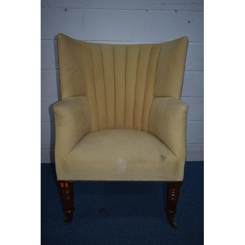 1348 - A REPRODUCTION BARRELL BACK ARMCHAIR, with beige stripped fabric, on turned front legs and brass cap... 