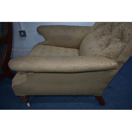 1351 - A LATE VICTORIAN ARMCHAIR, with deep armrests, on carved front legs, and ceramic casters, width 75cm... 