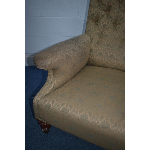 1351 - A LATE VICTORIAN ARMCHAIR, with deep armrests, on carved front legs, and ceramic casters, width 75cm... 