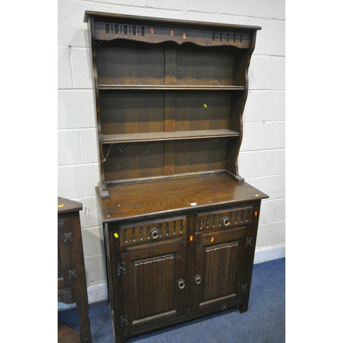 1199 - AN OAK LINENFOLD DRESSER, with two drawers, width 100cm x depth 47cm x height 187cm, an oak two door... 