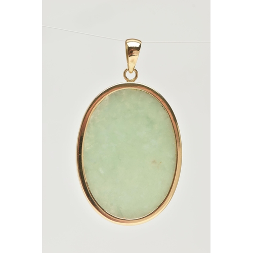 17 - A YELLOW METAL JADE PENDANT, designed as an oval slice of green jade, collet set in a yellow metal, ... 