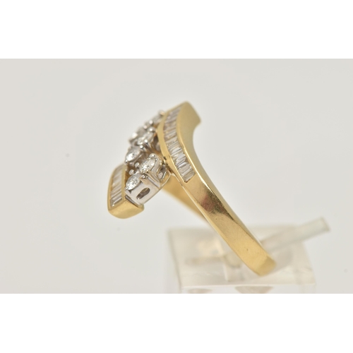 8 - A YELLOW AND WHITE METAL DIAMOND CROSS OVER RING, set to the centre with three marquise shape mounts... 