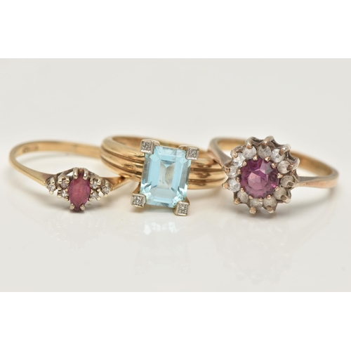 47 - THREE GEM SET RINGS, the first an oval cut ruby, prong set in yellow gold, flanked with six single c... 