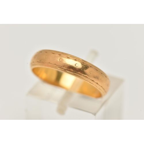 53 - A 22CT GOLD BAND RING, worn textured pattern, approximate band width 4.4mm, hallmarked 22ct London, ... 