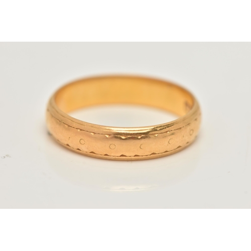53 - A 22CT GOLD BAND RING, worn textured pattern, approximate band width 4.4mm, hallmarked 22ct London, ... 