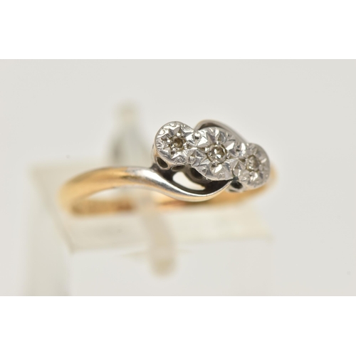 56 - A YELLOW METAL DIAMOND RING, three illusion set single cut diamonds, in a white metal mount, cross o... 