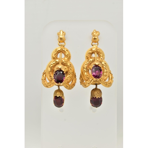 67 - A YELLOW METAL VICTORIAN GARNET SET BROOCH AND MATCHING EARRING SET, the brooch designed as four int... 