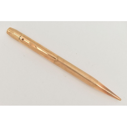 70 - A 9CT GOLD PROPELLING PENCIL, engine turned and polished pattern, hallmarked 9ct Birmingham 1987, ma... 