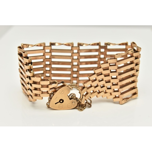 81 - A GATE BRACELET WITH HEART PADLOCK CLASP, designed with twist outer links and graduated terminals to... 