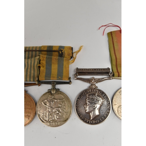 102 - A SELECTION OF MEDALS, to include a George VI, Palestine general service medal, awarded to 'CAPT. H.... 