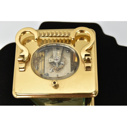 127 - A BRASS REPEATER CARRIAGE CLOCK, cream dial with central decoration, Roman numerals, open work hands... 