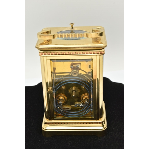 127 - A BRASS REPEATER CARRIAGE CLOCK, cream dial with central decoration, Roman numerals, open work hands... 