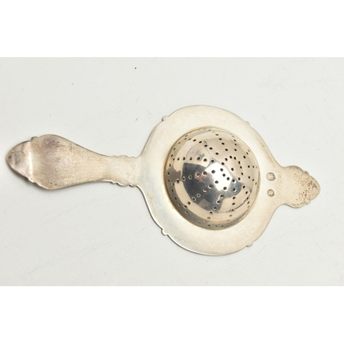 138 - A WHITE METAL TEA STRAINER WITH STAND, stamped with Danish silver control marks for Christian F Heis... 
