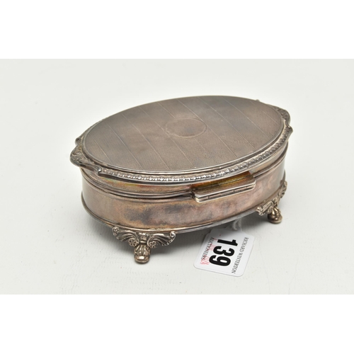 139 - AN ELIZABETH II SILVER TRINKET BOX, oval form box, raised on four scrolling feet, lined with read fe... 