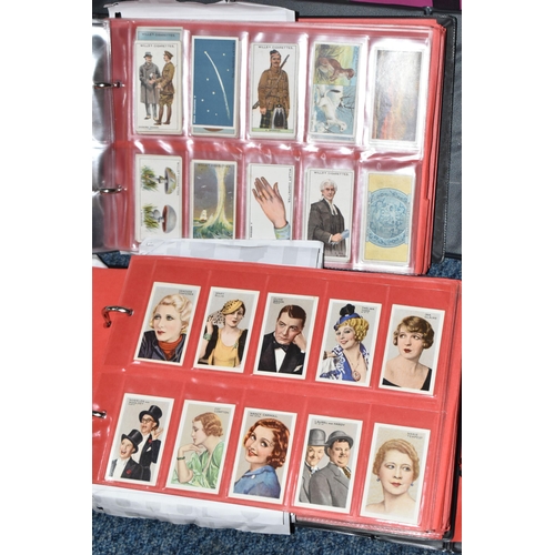 309 - ONE BOX OF CIGARETTE CARDS IN FOUR ALBUMS & LOOSE comprising full and part sets of popular cards, mo... 