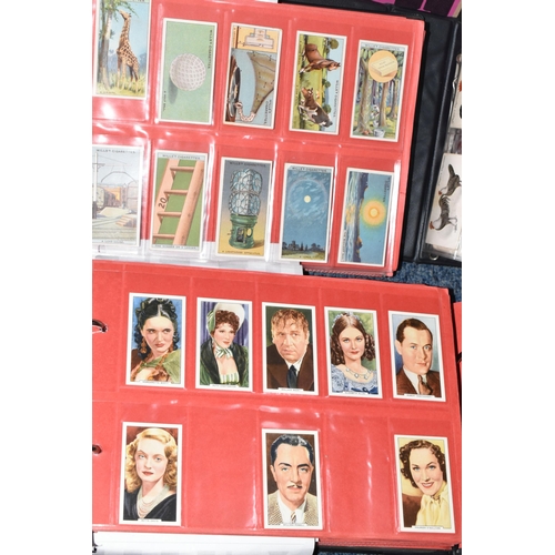 309 - ONE BOX OF CIGARETTE CARDS IN FOUR ALBUMS & LOOSE comprising full and part sets of popular cards, mo... 