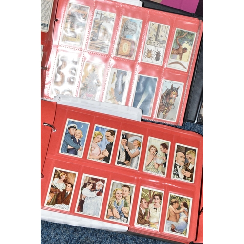 309 - ONE BOX OF CIGARETTE CARDS IN FOUR ALBUMS & LOOSE comprising full and part sets of popular cards, mo... 