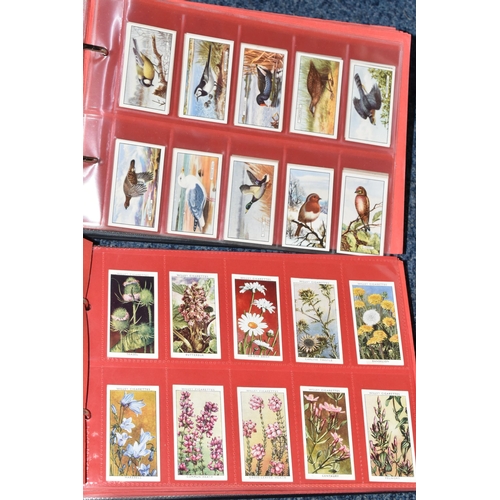 309 - ONE BOX OF CIGARETTE CARDS IN FOUR ALBUMS & LOOSE comprising full and part sets of popular cards, mo... 