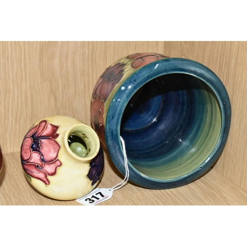 317 - TWO PIECES OF MOORCROFT POTTERY, comprising an 'Anemone' pattern planter, signed in green and impres... 