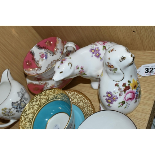 321 - A GROUP OF NAMED TEAWARE AND TWO ROYAL CROWN DERBY PAPERWEIGHTS, comprising two Royal Crown Derby pa... 