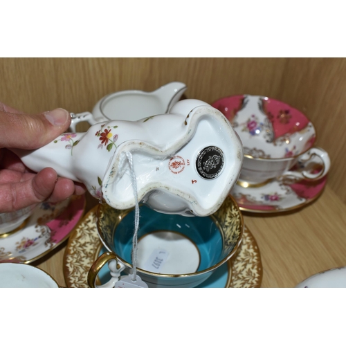 321 - A GROUP OF NAMED TEAWARE AND TWO ROYAL CROWN DERBY PAPERWEIGHTS, comprising two Royal Crown Derby pa... 