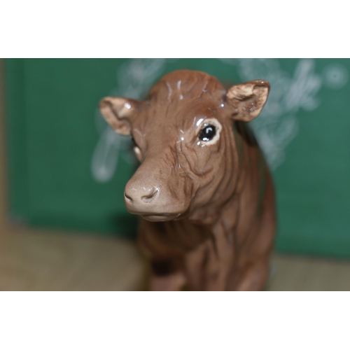 327 - A BOXED BESWICK 'LIMOUSIN COW', comprising model number 3075B, brown and white gloss, issued 1998 in... 