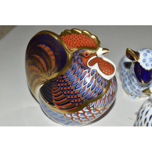 334 - THREE ROYAL CROWN DERBY PAPERWEIGHTS, comprising 'Cockerel' and 'Lamb', both have gold stoppers and ... 