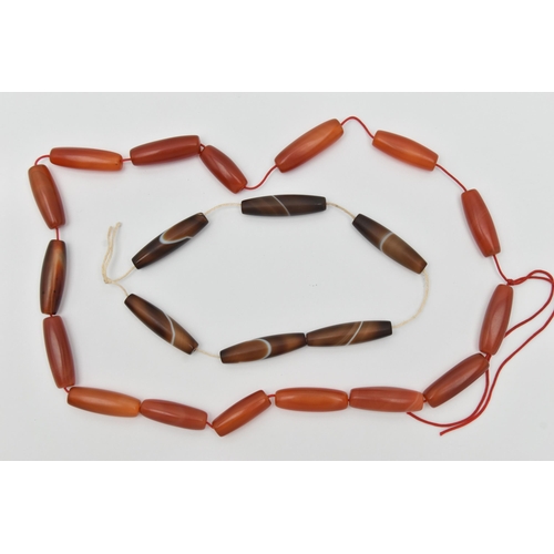 160A - TWO STRINGS OF AGATE BARREL BEADS, the first made up of sixteen polished barrel shape carnelian bead... 