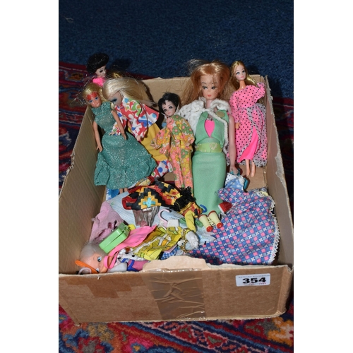 354 - A QUANTITY OF EARLY 1970S DOLLS AND CLOTHING, to include Mattel Heather from Rock Flowers, Topper Da... 