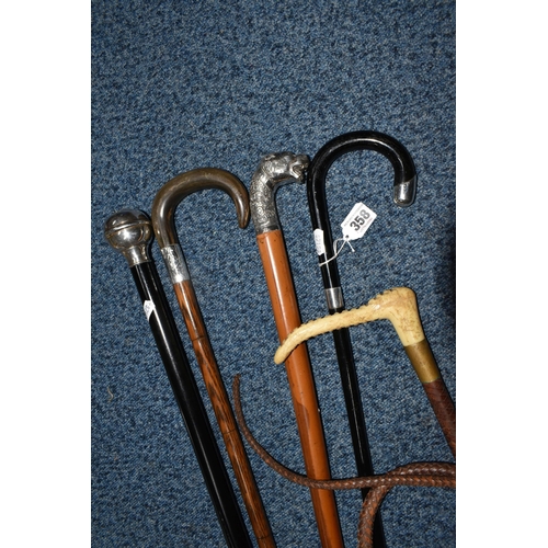 358 - A GROUP OF FOUR WALKING STICKS AND A HUNT MASTER'S RIDING CROP, comprising a Moss Bros. plaited leat... 