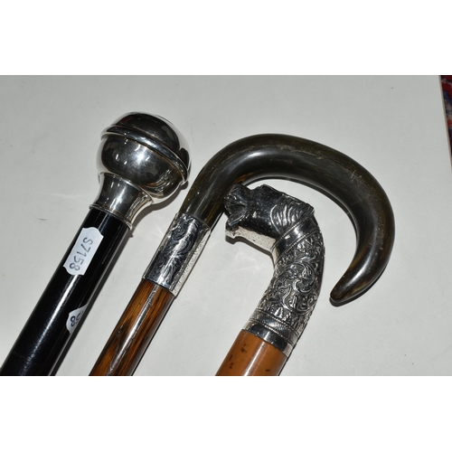 358 - A GROUP OF FOUR WALKING STICKS AND A HUNT MASTER'S RIDING CROP, comprising a Moss Bros. plaited leat... 