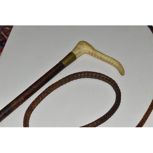 358 - A GROUP OF FOUR WALKING STICKS AND A HUNT MASTER'S RIDING CROP, comprising a Moss Bros. plaited leat... 