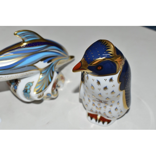 371 - TWO ROYAL CROWN DERBY PAPERWEIGHTS, comprising Striped Dolphin and Rockhopper Penguin, each with a g... 